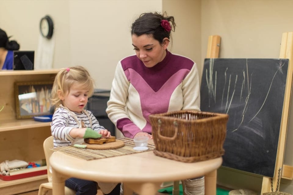 A Paché Montessori guide working with a toddler